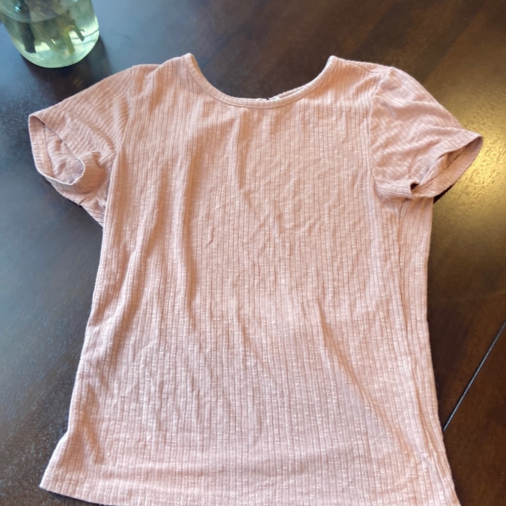 Pink top with open back and button closure